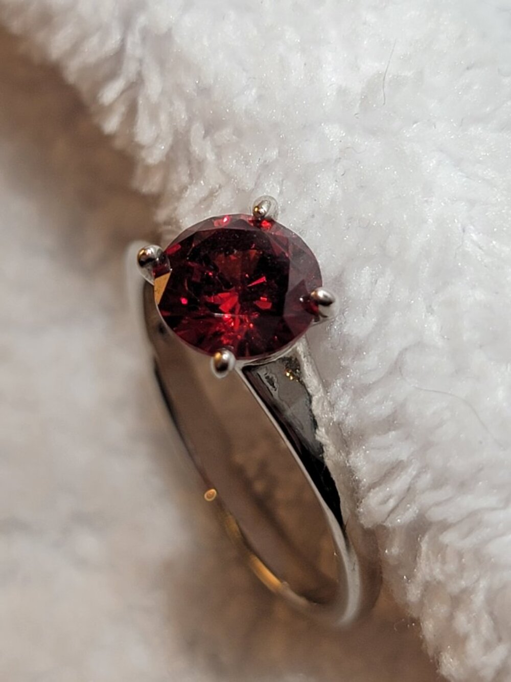 Delicate and simple, a red garnet round cut solitaire ring - January Birthstone